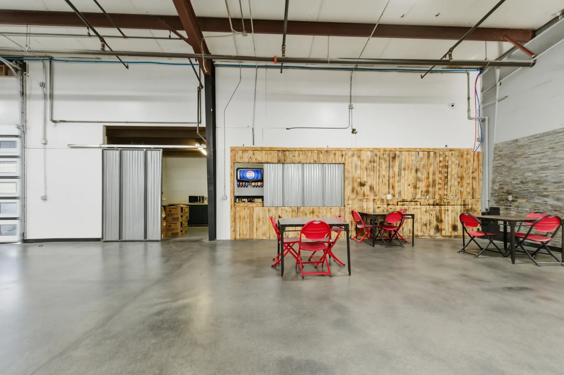 Soda bar and casual tables inside The Arena